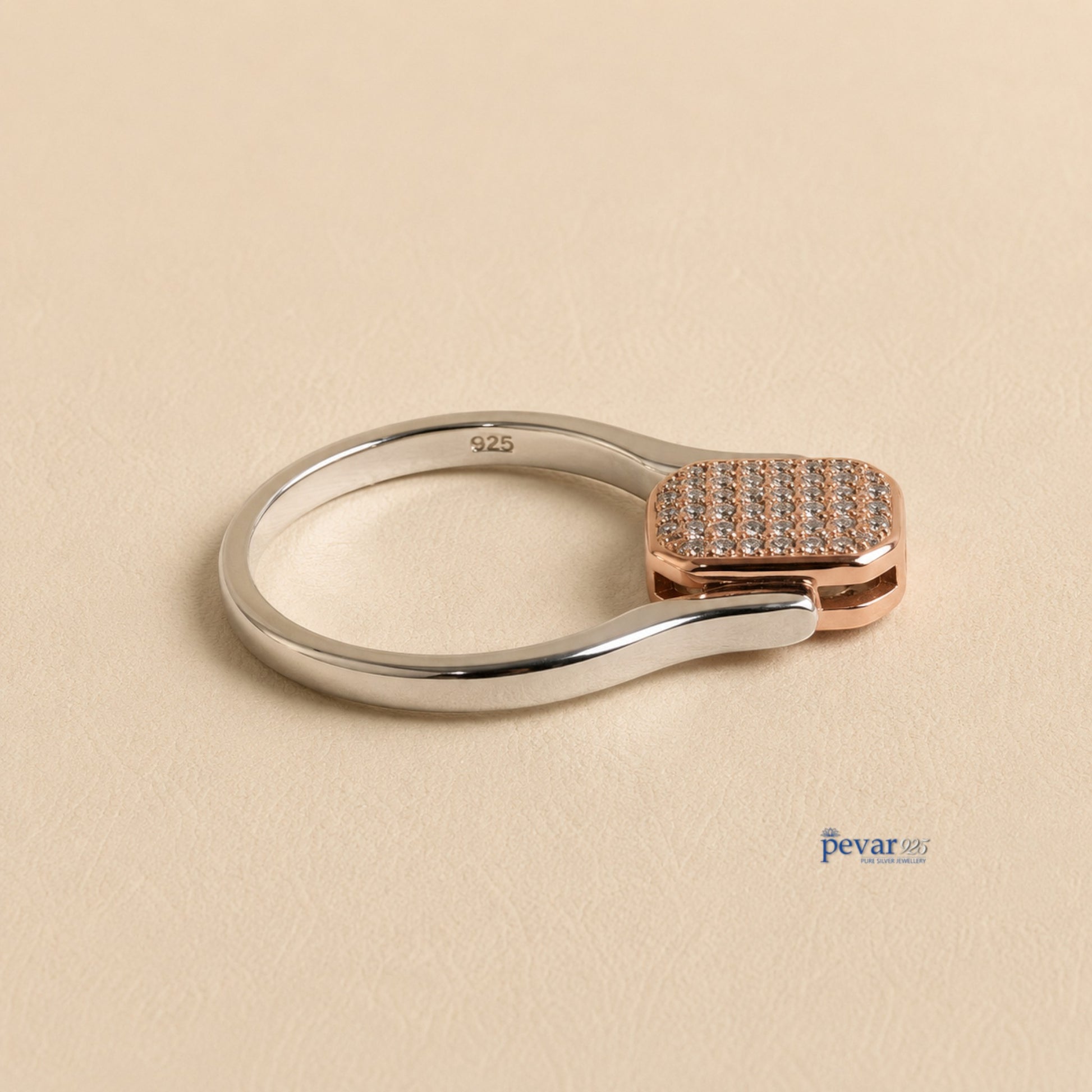 pevar925 sterling silver flip ring with a rectangular dual-tone top featuring zircon accents on a beige background
