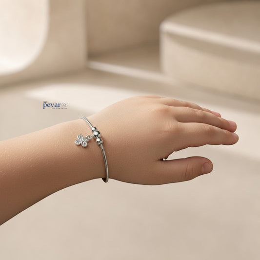 pevar925 sterling silver floral charm bracelet with clear gemstones on a delicate chain worn on a child's wrist