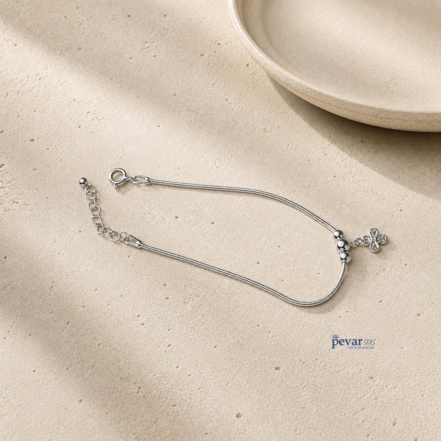 pevar925 sterling silver floral charm bracelet with a delicate chain and sparkling gemstone flower detail