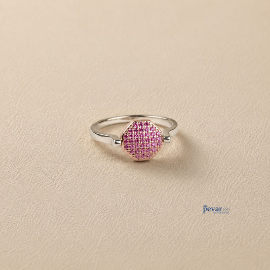 pevar925 sterling silver adjustable flip ring with a pink gemstone hexagon top on a neutral textured background