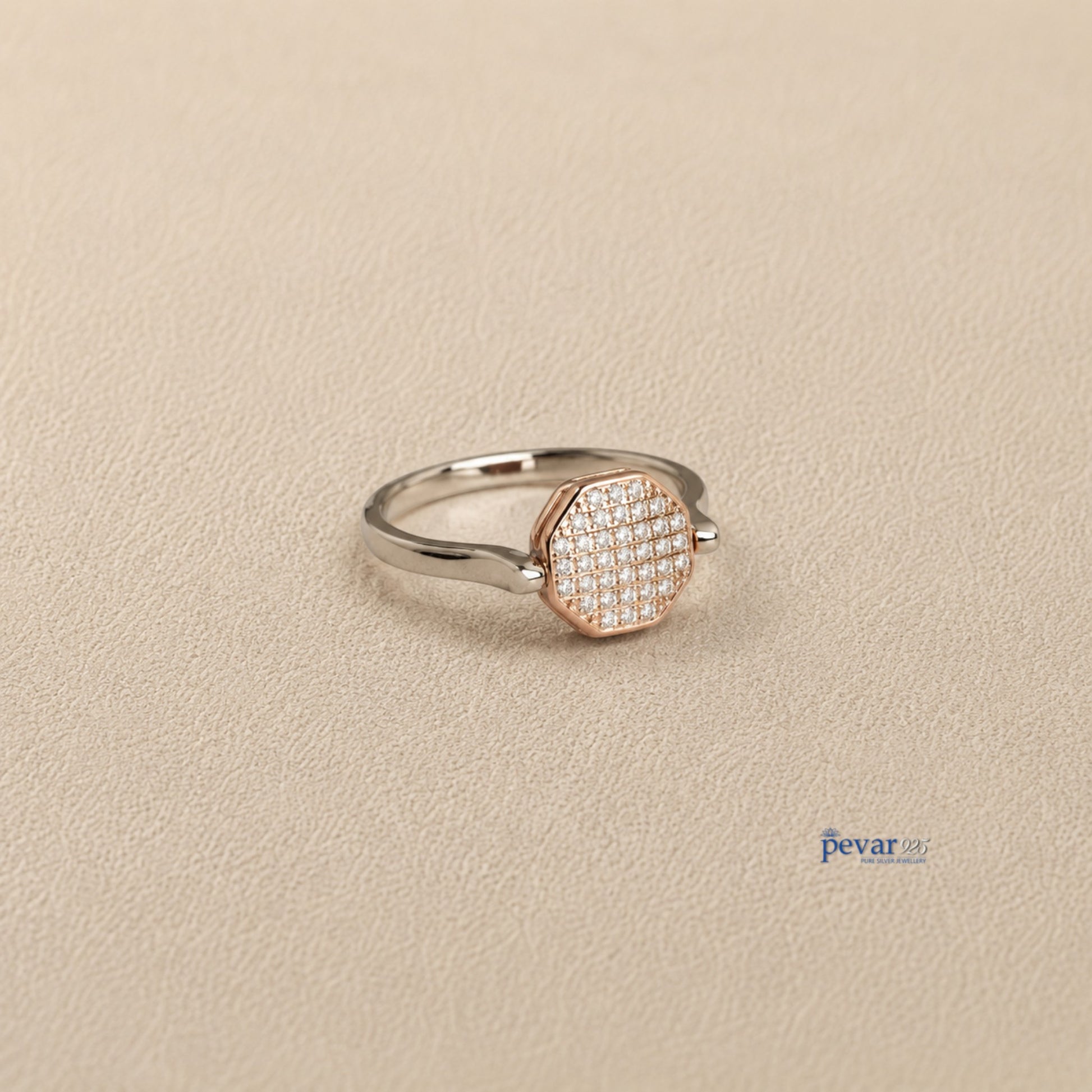pevar925 sterling silver dual tone hexagon flip ring with zircon stones and rhodium plating on a textured surface