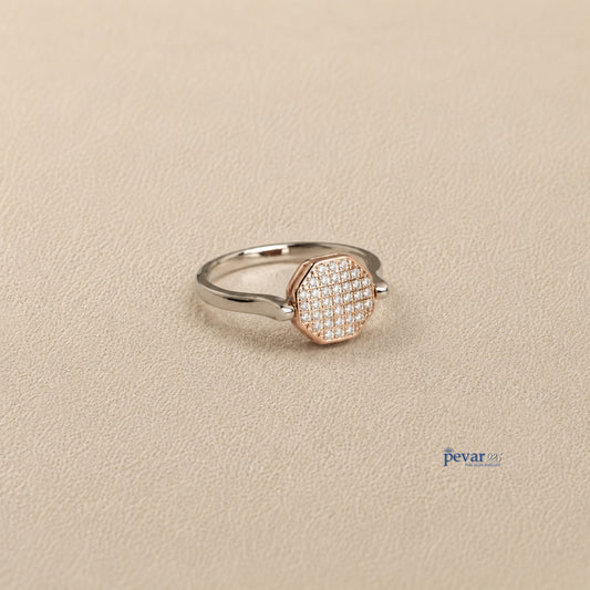pevar925 sterling silver dual tone hexagon flip ring with zircon stones and rhodium plating on a textured surface