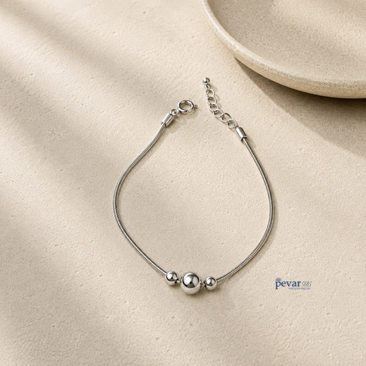 pevar925 sterling silver kids charm bracelet with three polished beads on a delicate chain, rhodium plated