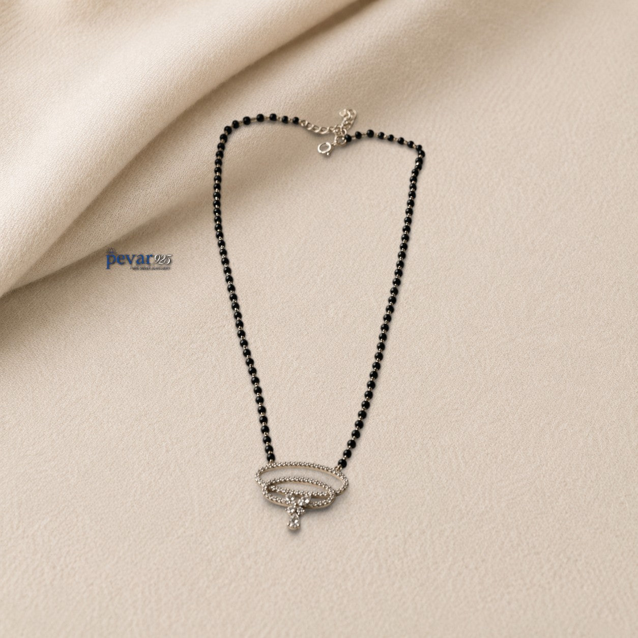 pevar925 sterling silver mangalsutra with black beads and a dual oval pendant featuring sparkling stones