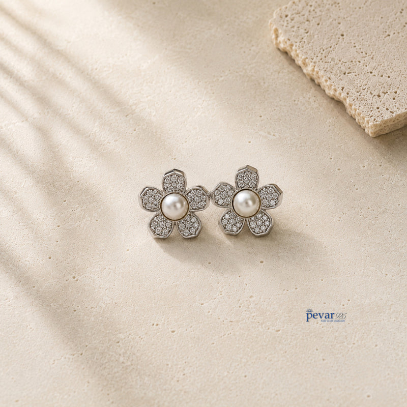 pevar925 sterling silver flower earrings featuring a central white pearl and sparkling pavé stones on a textured base