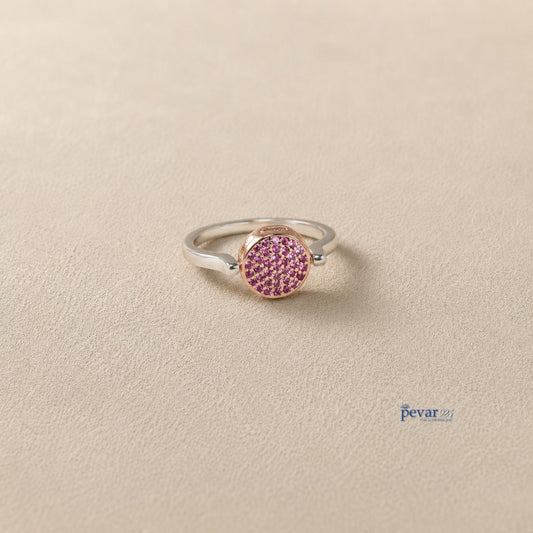 pevar925 sterling silver flip ring with a reversible circular top featuring pink gemstones on a neutral background