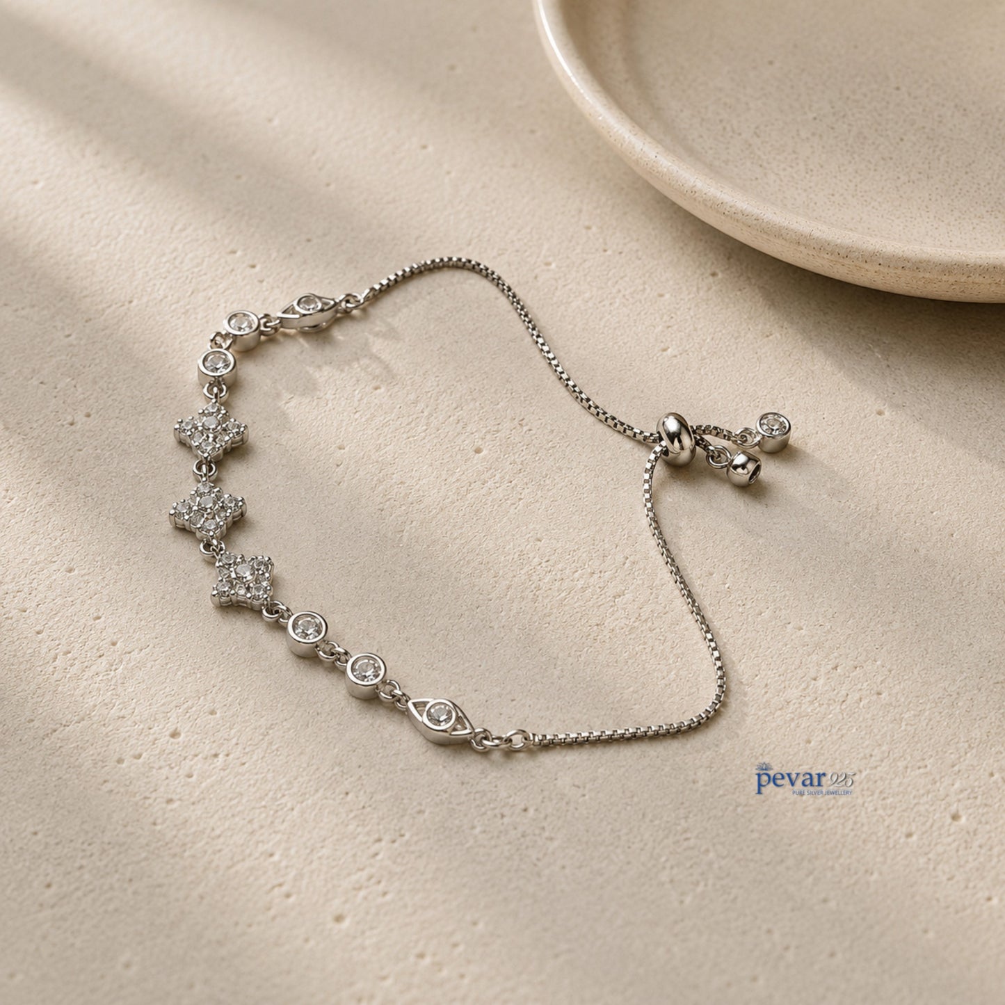 pevar925 sterling silver adjustable bracelet featuring square diamond motifs and rhodium plating on a textured surface
