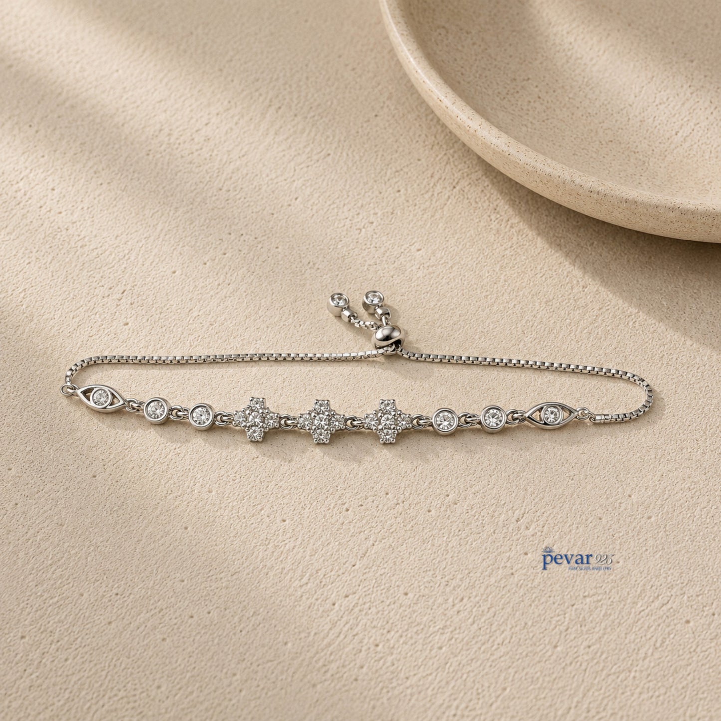 pevar925 sterling silver adjustable bracelet featuring square diamond motifs and rhodium plating on a textured surface.