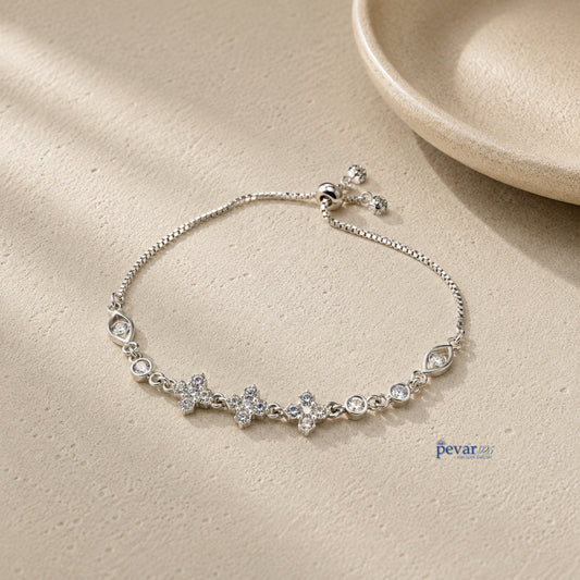 pevar925 sterling silver bracelet featuring square diamond motifs and adjustable chain on a textured beige surface