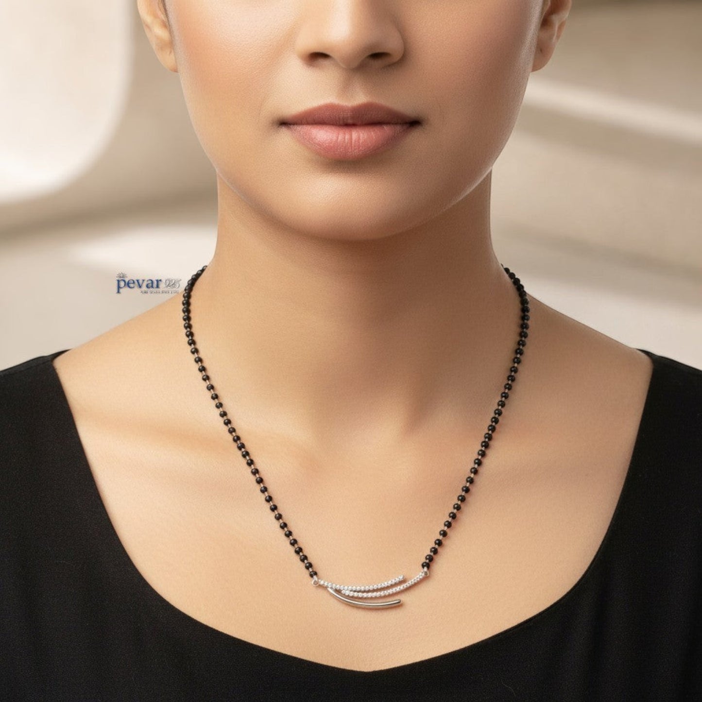 pevar925 sterling silver triple layer mangalsutra with black beads and a rhodium-plated motif worn on a model